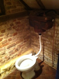 Toilet with copper-plated antique cistern